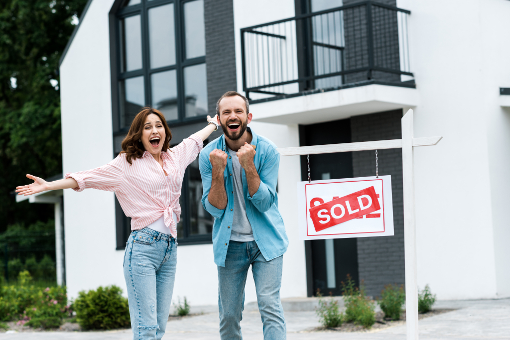 Happy couple buying a home