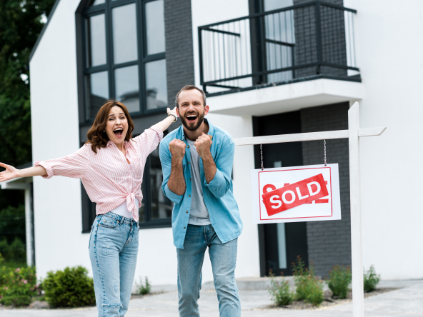 Happy couple buying a home